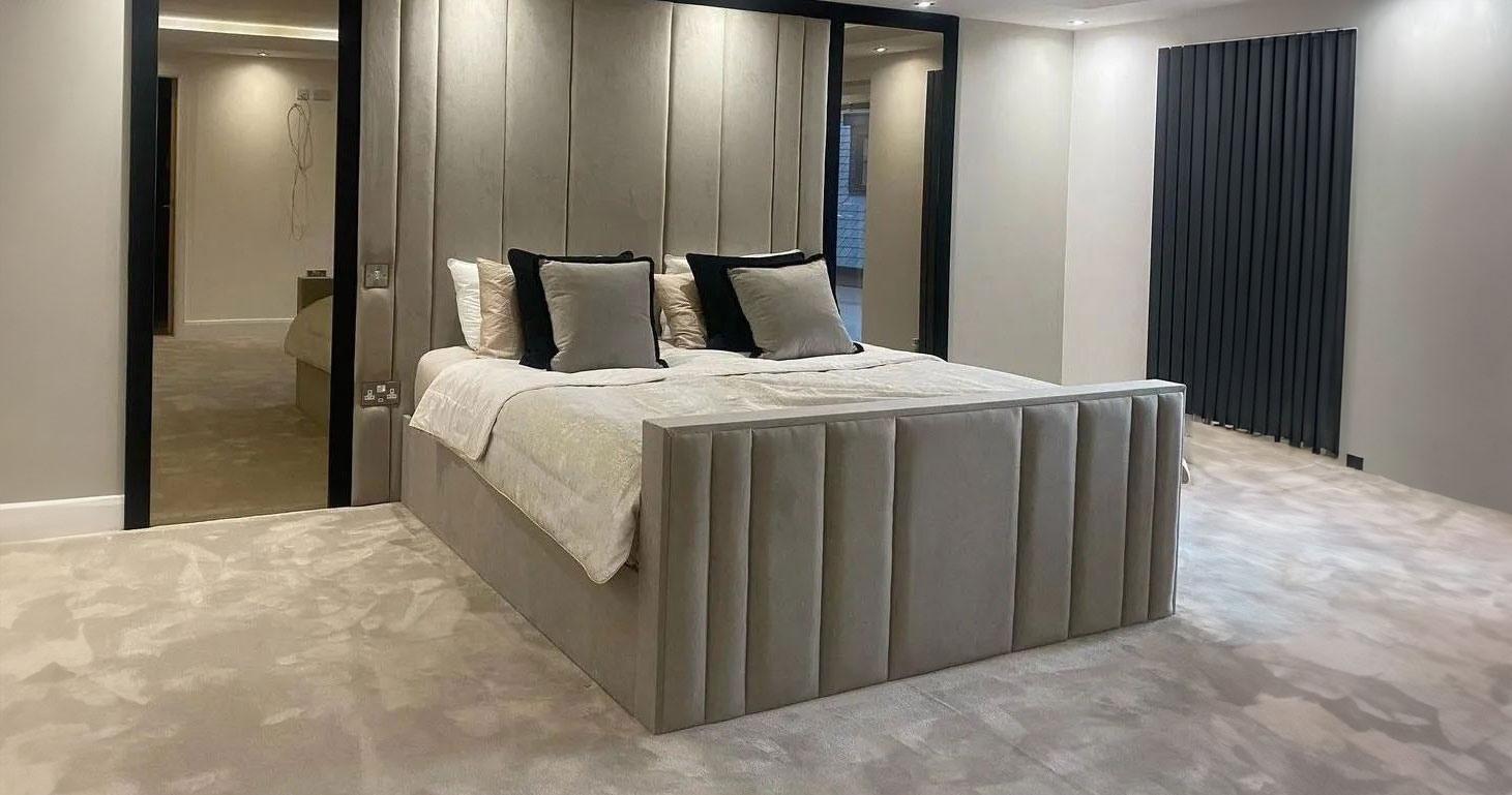 Modern bedroom with mirrored headboard and bed